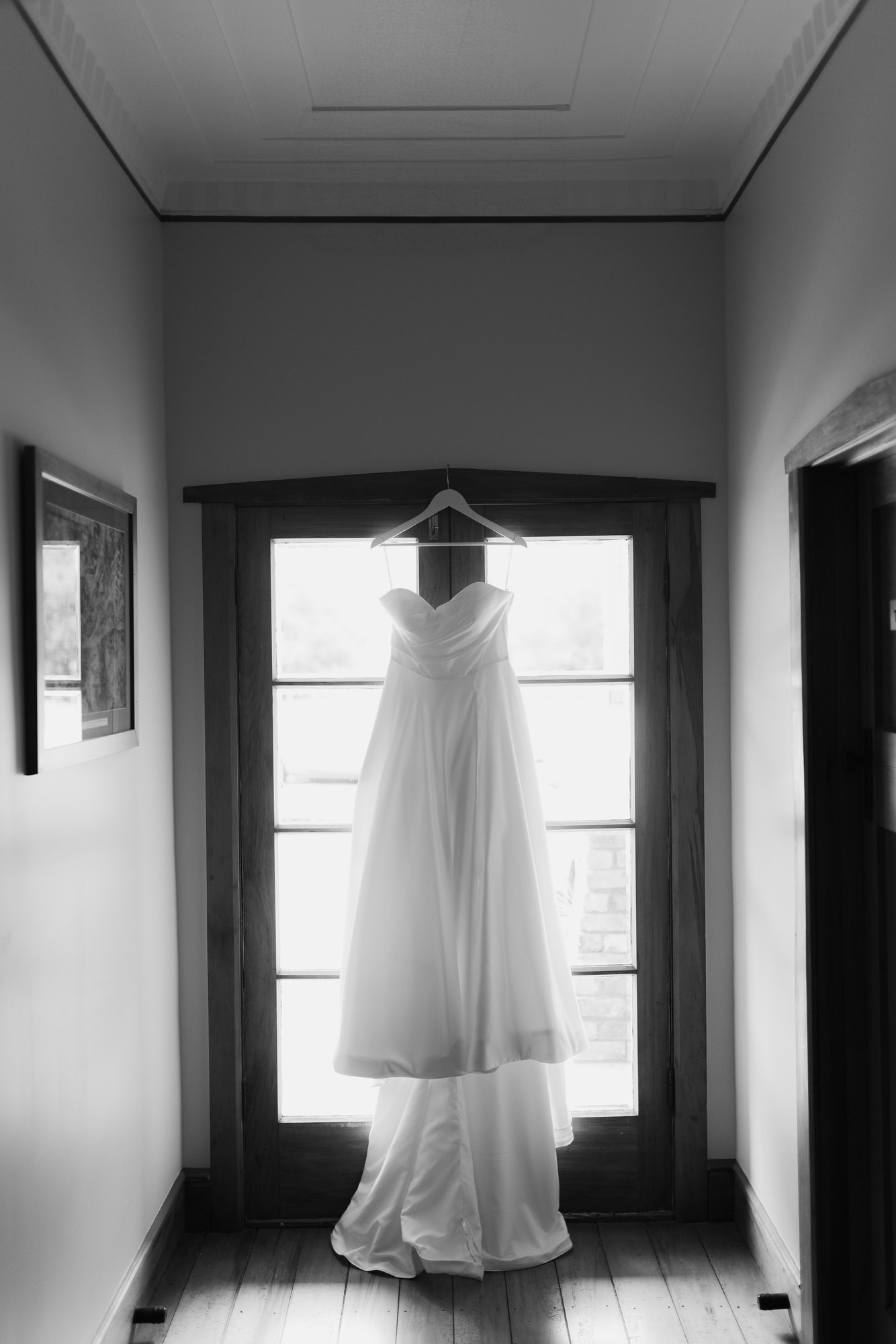 The dress hanging by the window